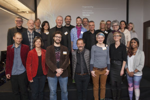 Speakers, partners and hosts gather for a group photo
